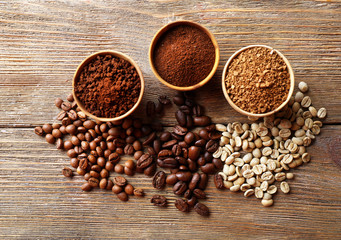 Various of coffee in small dishes on wooden table, top view