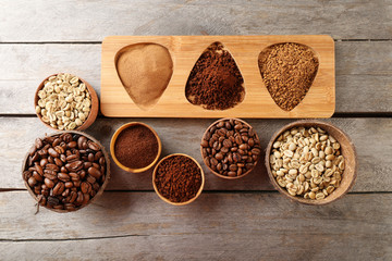 Various of coffee in small dishes on wooden table, top view