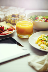 Fresh breakfast food. Scrambled eggs and juice.