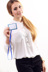 portrait of woman in business clothing with blank badge