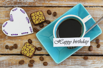 Happy Birthday card with cup of coffee, chocolates and heart