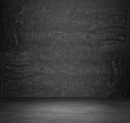 Dark concrete empty room. The chalkboard on the whole wall.