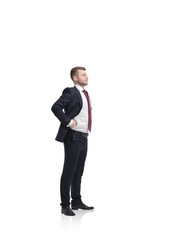 Standing young successful businessman. Isolated on white.