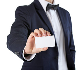 Elegant man in suit holding business card, isolated on white