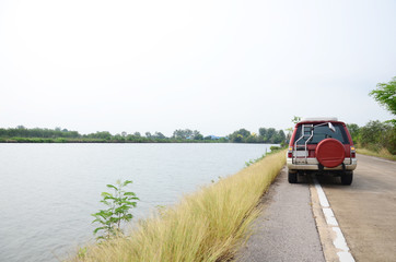 Van on road in countryside at Bangkhunthein