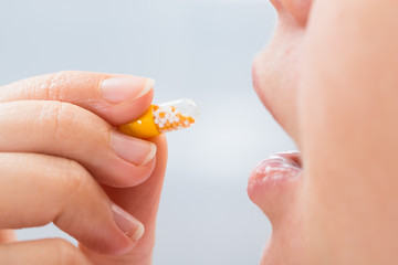 Person Eating Medicine