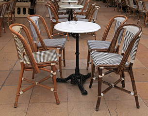 french outdoor cafe with small round tables and chairs