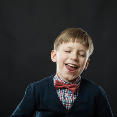 Close up portrait of young smiling cute boy