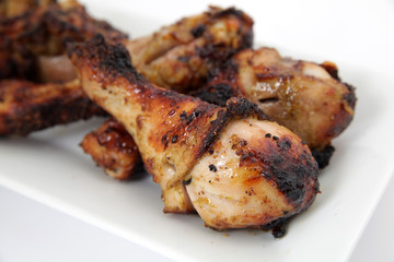 Close up of grilled chicken legs (drumsticks)