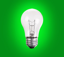 old generation Light Bulb on green background