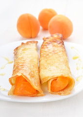 Pancakes with apricot slices