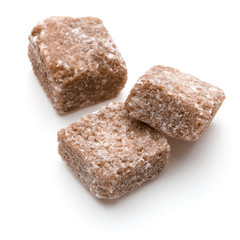 Brown lump cane sugar cube isolated on white background cutout