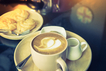 Cup of coffee with heart pattern  ( Filtered image processed vin