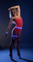 Image of sexy go-go dancer posing in UV light