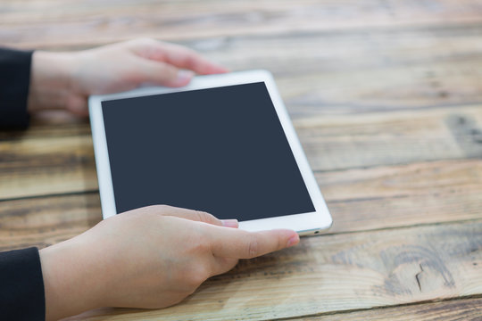 Woman hand touch white tablet with blank empty screen  ( with se