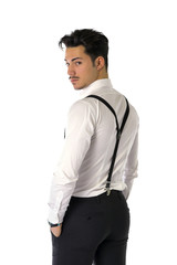 Handsome elegant young man with business suit, suspenders