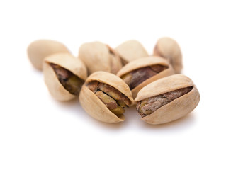 close up pistachio nuts on white with clipping path
