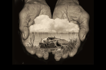 Hands Holding a Boat