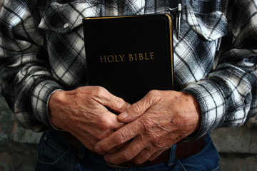 Old Man Holding a Bible