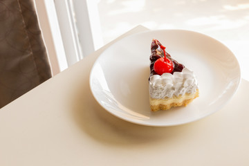 blueberry cheese cake with cherry on top