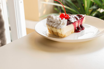 blueberry cheese cake with cherry on top