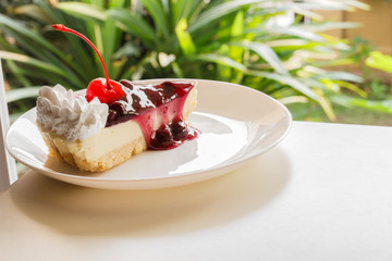 blueberry cheese cake with cherry on top