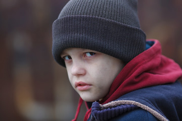 dramatic portrait of a homeless boy