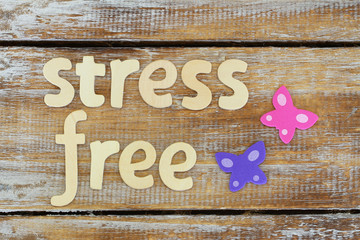 Stress free written with wooden letters on rustic surface