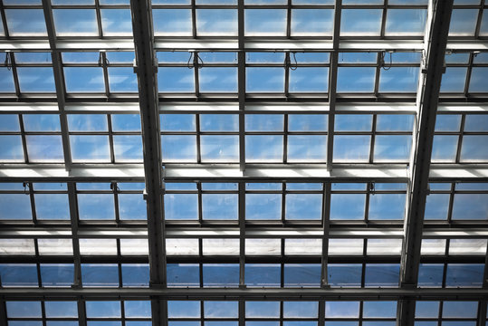 Mirror roof of  modern building with blue sky