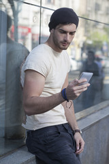 Young man talking by phone.