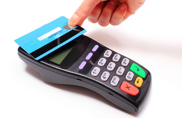 Hand of woman paying with contactless credit card,