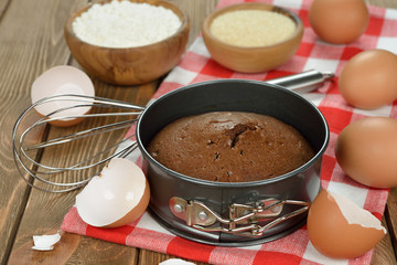 Chocolate cake and ingredients for baking