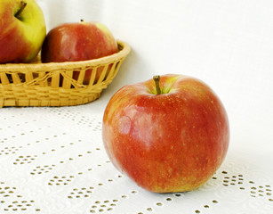 Apples on white embroidered napkin