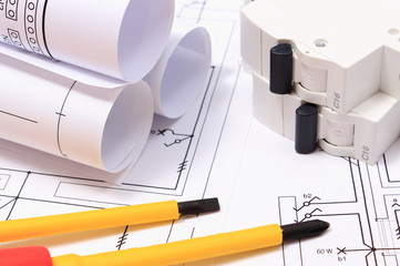 Screwdriver, diagrams and electric fuse on construction drawing