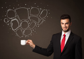 Businessman holding a white cup with speech bubbles
