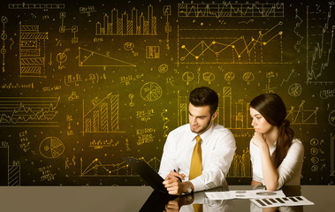 Business couple with diagram background