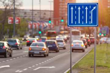 Traffic jam on city street at sunset