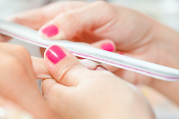 Nail treatment in beauty salon