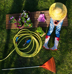 Woman having a break while working in the garden