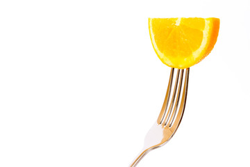 Concept of vegetarian food. Orange on fork