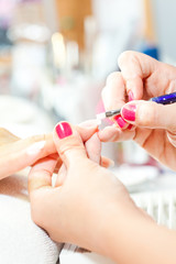 Process of nail treatment, applying white paint on fingernail