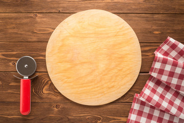 Pizza cutting board with tablecloth and round knife
