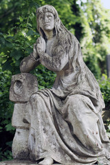 Fototapeta na wymiar Old statue on grave in the Lychakivskyj cemetery of Lviv, Ukrain