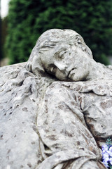 Fototapeta premium Old statue on grave in the Lychakivskyj cemetery of Lviv, Ukrain
