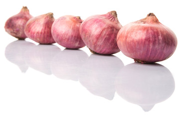 Large red onion over white background
