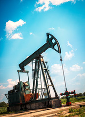 Oil industry ,well pump in field.