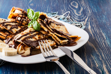 Crepes with banana and chocolate cream