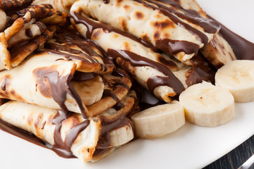 Crepes with banana and chocolate cream
