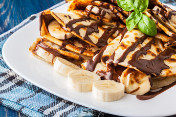 Crepes with banana and chocolate cream