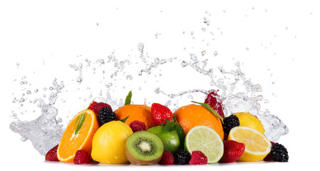 Mix of fruits with water splashes on white
